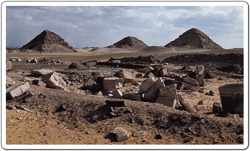 The scanty remains of Userkaf’s Solar Temple at Abusir, with the pyramids of  Sahure, Neferikare and Niuserre in the background.